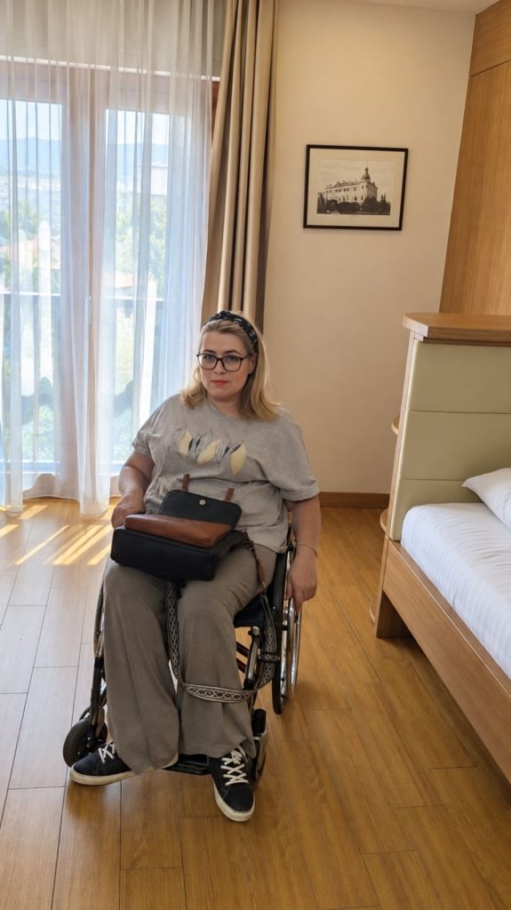 Wheelchair user in the spacious accessible room at Hotel Mostar, Bosnia and Herzegovina